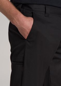 About Our LJ Stretch Twill Work Pants for Tall Men We know how hard it is to find long inseam pants, especially ones with style. That’s why we’ve created these pants for tall men. They’re tailored specifically for guys from 6’3 to 7’1, so they have an extra-long inseam for extra-long legs. Perfect for wearing from the office to the workshop, these men’s tall pants are elevated yet functional. They’re made with a durable tri-blend that’s infused with stretch and naturally wrinkle-resistant. The t Classic Black Cargo Pants For Work, Fitted Work Pants With Side Pockets And Straight Hem, Fitted Bottoms With Cargo Pockets For Workwear, Classic Black Work Pants With Hip Pockets, Classic Black Cargo Pants With Belt Loops, Business Trousers With Side Pockets, Classic Fitted Pants With Cargo Pockets, Fitted Cargo Pants With Side Pockets For Work, Fitted Tapered Leg Cargo Pants For Business Casual