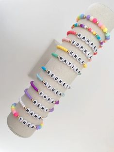 one colorful beaded name bracelet bracelets are made on a durable stretch elastic cord please refer to our sizing guide before purchasing Adjustable Multicolor Beaded Bracelets With Letter Beads, Trendy Adjustable Hand-strung Stretch Bracelet, Everyday Colorful Beaded Stretch Bracelet, Multicolor Name Bracelet With Letter Beads And Round Beads, Personalized Multicolor Round Bead Friendship Bracelets, Personalized Adjustable Heishi Beads Bracelet, Trendy Beaded Bracelets With Letter Beads For Birthday, Personalized Adjustable Heishi Beaded Bracelets, Multicolor Name Bracelet With Round Letter Beads