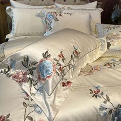 the comforter is made up with flowers on it