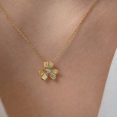 The necklace's floral design represents the blossoming of love and the growth of a strong and lasting relationship as you embark on your journey as a married couple. the clover is also seen as a symbol of fidelity and faithfulness. By wearing the Clover Flower Necklace, you may be expressing your commitment to remain loyal and devoted to your partner throughout your marriage. MATERIALS * 925 sterling silver * 18K Gold plated over 925 sterling silver * Adjustable (the adjustable length is about 1 Charming Flower Pendant Jewelry With Charm, Charming Flower Pendant Jewelry, Charming Flower Pendant Necklace, Charming Wedding Jewelry With Flower Charm, Delicate Flower Charm Necklace For Mother's Day, Delicate Flower Charm Necklace For Bridesmaids, Bridesmaid Gift Necklace With Flower Charm, Charming Gold Flower Necklace, Feminine Flower Pendant Necklace With Clavicle Chain