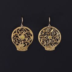 These antique earrings were created from Georgian watchcocks (circa 1780-1800) by adding yellow diamonds and 14k gold ear wires to the gold gilt (or pinchbeck) dangles. Each earring measures 1.25 inches from the top of the ear wire to bottom by 0.8 inches wide and are in great condition. We have many other fantastic offerings of period fine and costume jewelry posted on our Etsy store, so please consider browsing our other items. We send all items in individually packaged gift boxes and offer la Traditional 14k Gold Pierced Jewelry, Antique 14k Gold Hallmarked Earrings, Traditional 14k Gold Drop Earrings, Yellow Earrings With Intricate Design For Gift, Antique Earrings With 17 Jewels For Ceremonial Occasions, Victorian Filigree Oval Earrings, Victorian Oval Filigree Earrings, Antique Pendant Yellow Gold Earrings, Vintage Yellow Gold Earrings With Intricate Design