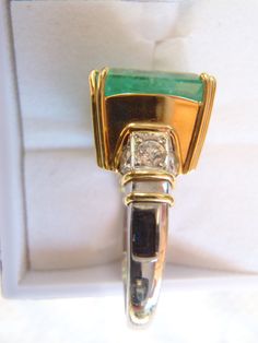 Simply sublime. This unique ring is the highlight of my Etsy collection. A rare stunner with an 8+ carat emerald and one carat total weight in white diamonds. This was a custom handmade ring I helped to design, and picked the stones myself, a rectangular shape natural emerald, gauging 13.00 x 10.40 x 9.00mm, exact weight 8.13 carats. 10 round brilliant cut diamonds accent the ring. One of the premier jewelers here in Wine Country made it; the top in pure 18K yellow gold and the shank in platinum Luxury Emerald Ring For May Birthstone, Gia Certified Yellow Gold Emerald Ring For Formal Occasions, Luxury Green Diamond Ring For Formal Occasions, Princess Cut Diamond Ring For May Birthstone, Luxury Yellow Gold Emerald Cut Emerald Ring, Luxury Yellow Gold Emerald Cut Ring, Gia Certified Formal Emerald Cut Emerald Ring, Formal Gia Certified Yellow Gold Emerald Ring, Luxury Emerald Ring For Anniversary, May Birthstone