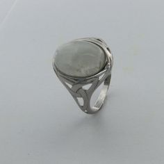 These is a beautiful pair of Sterling Silver R ing with a Rainbow Moonstone Gemstone. The ring are made out of solid 925 Silver and there is no nickel or other substances causing most allergies. This makes the ring hypo allergenic. Size of the Moonstone 1.4 x 1.1 cm or 0.55 x 0.43 inch You will receive the item in a gift box - perfect to surprise someone or yourself. Usually we ship on the same day we receive the payment for the order. We want you to be happy with your purchase. If you do not li Modern White Gold Moonstone Ring For Anniversary, Modern Silver Sterling Silver Crystal Ring, Silver Moonstone Ring With Round Stone, Silver Opal Ring With Bezel Setting For Promise, Silver Opal Promise Ring With Bezel Setting, Sterling Silver Cabochon Wedding Rings, Anniversary Silver Moonstone Ring With Stone Setting, White Gold Moonstone Ring With Gemstone, Silver Oval Opal Ring Stamped 925