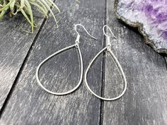 "These super lightweight teardrop hoop earrings feature 40mm x 26mm brass open teardrops. Choose silver-plated or gold-plated! These minimalist geometric earrings will complement any outfit, and are lightweight enough for all day wear! The earrings measure 2.5 inches from the bottom of the teardrop to the top of the ear wires. The gold earrings have hypoallergenic gold-plated surgical steel ear wires, while the silver earrings have hypoallergenic surgical steel ear wires. These earrings are incr Everyday Metal Teardrop Drop Earrings, Everyday Metal Teardrop Earrings, Hypoallergenic Teardrop Earrings For Everyday, Nickel-free Teardrop Earrings For Everyday Wear, Teardrop Hoop Earrings For Everyday, Everyday Teardrop Hoop Earrings, Everyday Teardrop Nickel Free Earrings, Everyday Teardrop Earrings With Ear Wire, Minimalist Nickel-free Teardrop Earrings