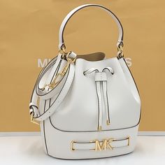 Michael Kors Reed Medium Pebbled Leather Bucket Bag Satchel Crossbody Handbag Optic White Nwt New With The Tag Authentic The Reed Infuses Glamor Into An Otherwise Austere Bucket Bag Design. Crafted From Smooth Leather, It Features A Drawstring Closure That Opens To A Spacious Interior. A Belted Feature With Our Gold-Tone “Mk” Hardware And Coordinating Accents Finish It With A Gilded Touch. Carry It By The Top Handle Or Wear It Crossbody With The Removable Strap. Bucket Bag Pebbled Leather 100% L White Formal Bucket Bag With Detachable Handle, White Bucket Bags With Removable Pouch, White Formal Bucket Shoulder Bag, Formal White Bucket Bag With Detachable Handle, White Formal Shoulder Bucket Bag, White Top Handle Bucket Bag For Travel, Classic White Bucket Bag For Daily Use, Luxury White Bucket Bag For Shopping, Formal White Tote Bucket Bag