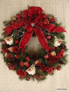 a christmas wreath with red and white decorations