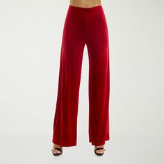 With their smooth, velvety texture and flowing wide-leg silhouette, these rich red women's pull-on pants from Premier Amour add a glam touch to your wardrobe. They're made from stretch fabric ensuring comfortable wear and have a flat front and a flattering mid-rise. Wear yours with a crop top and heels. Front Style: Flat FrontFeatures: Stretch FabricClosure Type: Pull OnFit: Loose FitRise: Mid RiseFiber Content: 95% Polyester, 5% SpandexFabric Description: VelvetLining: UnlinedInseam: 32 InLeg S Large Pants, Diy Fabric, Pants Color, Pull On Pants, Stretch Fabric, Mid Rise, Wide Leg, Crop Top, Velvet