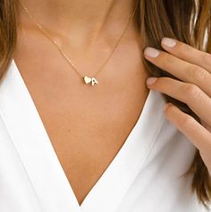 "PERSONALIZED INITIAL HEART NECKLACE Treat yourself or a friend! Our Personalized Initial Heart Necklace offers elegant style details while adding the minimalist touch of meaning to your everyday look. This dainty piece features an initial perfectly accented with a heart. ITEM SPECIFICATIONS * Finish: 925 Sterling Silver ∙ 18K Gold ∙ Rose Gold * Dimensions: Length 17\"	in stock	35.00 USD	17.50 USD	0.00 USD	Weddings > Jewelry > Necklaces
https://i.etsystatic.com/39711490/r/il/234023/4923593704/il Initial Heart Necklace, Tiny Heart Necklace, Personalized Gold Necklace, Initial Necklace Silver, Alphabet Necklace, Initial Necklace Gold, Letter Pendants, Initial Letter, Spring Sale