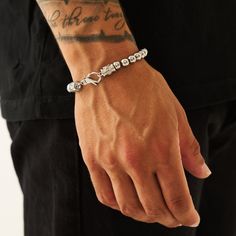 A master in disguise. With discreet emblem embellishment and a reinforced lobster clasp, there’s more to this bracelet than meets the eye. Built to be worn on repeat, each Silver sphere is hand-strung on a hidden metal chain, ensuring durability and a clean everyday aesthetic. ✓ 316L Stainless Steel & Rhodium✓ Water, Heat, Sweat Resistant✓ Hypoallergenic (No Green Skin)Model is 5'11 & Wears 19cm Length. Adjustable Silver Link Bracelet, Everyday Silver Jubilee Chain Bracelet, Silver Chain Link Bracelets For Everyday, Silver Minimalist Bracelet With Lobster Clasp, Modern Silver Charm Bracelet For Everyday, Minimalist Silver Bracelet With Lobster Clasp, White Gold Chain Bracelet With Lobster Clasp For Everyday, Everyday White Gold Chain Bracelet With Lobster Clasp, Modern Sterling Silver Charm Bracelet With Lobster Clasp