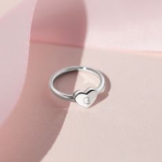 Your little girl will absolutely adore this delicately designed polished heart shaped ring. Beautifully crafted in genuine 925 sterling silver which is naturally hypoallergenic and suitable for girls with sensitive skin. Buffed to a brilliant luster, this sentimental choice for your little girl is destined to be cherished and is available in sizes 2-5. A gift box is included, ready for gift giving. Dainty Personalized Silver Heart Ring, Sterling Silver Heart-shaped Midi Promise Rings, Adjustable Open Heart White Gold Ring, Adjustable White Gold Open Heart Ring, Personalized Heart Jewelry, Sterling Silver Heart Ring With Heart Charm, Sterling Silver Heart Ring With Charm, Sterling Silver Heart Charm Ring, Sterling Silver Heart Ring For Birthday And Valentine's Day