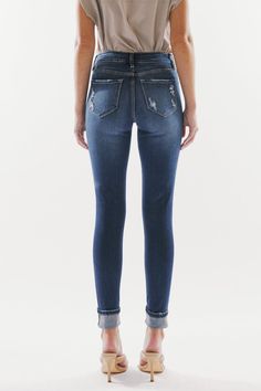 Our Chelsea High Rise Jeans come in a super skinny fit with whiskering, light distress, and a gently faded wash. Sits slightly above the natural waistline as it tapers down the leg and finishes with a folded hem creating a casual design that's perfect for on-the-go days. Made with buttery-soft stretch denim that's flexible and breathable. Features a classic five-pocket design and four-button front closure. 9.5" Rise / 28.5" Inseam 54% Cotton, 34% Rayon, 10% Polyester, 2% Spandex Model in size 25 Dark Wash Style # : KC6192D Stretchiness Level >> Stretch SIZE WAIST HIP 0 / 23 23.5" 30.5" 1 / 24 24.5" 31.5" 3 / 25 25.5" 32.5" 5 / 26 26.5" 33.5" 7 / 27 27.5" 34.5" 9 / 28 29" 36" 11 / 29 30.5" 37.5" 13 / 30 32" 39" 15 / 31 33.5" 40.5" Super Dark, Casual Design, High Rise Jeans, Favorite Jeans, Pocket Design, Stretch Denim, Chelsea, High Rise, Chelsea Fc