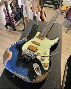 an electric guitar sitting on top of a table