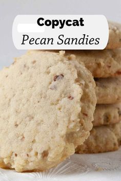 several cookies stacked on top of each other with the words copycat pecan sandies