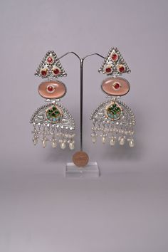 This is one of the amazing entries in our jewelry design collection that has been made out of silver polish and Monalisa curved stonework and it also comes with earrings to complete the whole look. Bollywood Designer Cutdana Earrings, Bollywood Cutdana Earrings For Designer Wear, Bollywood Style Designer Earrings With Cutdana, Traditional Designer Chandbalis, Traditional Designer Earrings For Diwali, Traditional Festive Designer Earrings, Navratri Kundan Designer Jewelry, Kundan Jewelry For Navratri Designer Wear, Designer Jewelry For Navratri