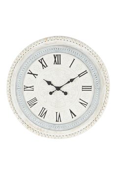 a white clock with roman numerals on the face