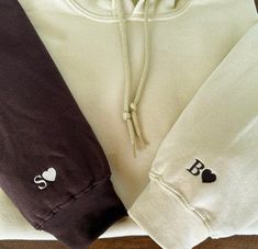 Cozy Embroidered Initial Hoodie - Personalized Unisex Pullover Add a personal touch to your style with our Embroidery Initial Hoodie! This cozy and stylish hoodie features a classic design with the addition of a customized embroidered initial of your choice. Made with high-quality materials, this hoodie is perfect for adding a unique flair to your everyday wardrobe. Whether you're looking for a thoughtful gift or a personal treat for yourself, this Embroidery Initial Hoodie is sure to make a sta Meaningful Christmas Gifts, Embroidered Initials, Couples Sweatshirts, Heart Hoodie, Matching Couple Shirts, Heart Sweatshirt, Iron Decoration, Heart Sweater, Couples Hoodies