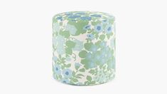 a green and blue flowered cylinder on a white background