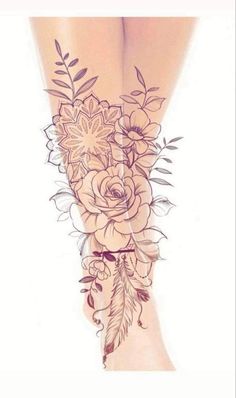 a woman's leg with flowers and leaves on it