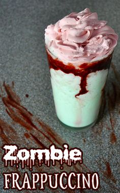 a cup filled with whipped cream and chocolate sauce on top of a gray surface next to the words zombie frappuccino