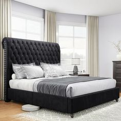 a black and white bed in a bedroom