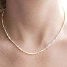 Item Details: Necklace can be ordered in 16" or 18" long. Strand of 2mm freshwater seed pearls. 14K gold spring clasp. Please allow 1 week for production and delivery. Berlinger Jewelry, Small Pearl Necklace, Tiny Pearl Necklace, Dainty Pearl Necklace, Aesthetic Accessories, River Pearls, Pearl Strands Necklace, 16 Inch Necklace, Small Necklace