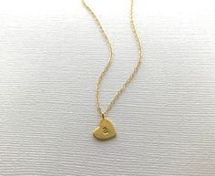 A beautiful heart necklace hand-stamped with your choice of letter initials. This multiple heart initial necklace is perfect for moms, mothers, grandma, grandmothers, girlfriends, wife, wives etc. Carry your loved ones with you wherever you go! Matte Gold 10mm gold-plated hearts, hand stamped with your choice of uppercase or lowercase letters. Choose between a gold plated or 14k gold filled chain. DETAILS: - 10mm heart stamped with UPPERCASE or lowercase initials - Matte Gold finish - Hand-stamp Dainty Heart Charm Name Necklace For Personalized Gift, Everyday Heart Charm Initial Necklace, Heart Shaped Initial Necklace For Mother's Day, Heart Pendant Initials Necklace For Mom, Heart Pendant Necklace With Initials For Mom, Customizable Heart Necklace For Mom, Mother's Day Anniversary Initial Necklace With Heart Charm, Dainty Heart-shaped Name Necklace For Anniversary, Heart Pendant Necklace With Charm For Mom