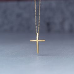 Minimal solid gold handmade cross necklace, curved 14k solid gold cross pendant. This is a beautiful handmade minimal cross with a curved front that makes it a bit different and unique. Available in 14k yellow and 14k white gold , please make your choice from the drop down menu. Minimal cross necklace, unisex pendant. Size: 1,7 cm / 0.7 inches long and 0.7 cm / 0,3 inches wide Material: 14k solid yellow gold or 14k solid white gold You can choose the charm with a yellow gold filled chain (white Minimalist Cross Pendant Necklace As Gift, Minimalist Yellow Gold Cross Pendant Necklace, Dainty 14k Gold Cross Necklace Gift, Dainty 14k Gold Cross Necklace As A Gift, Minimalist Yellow Gold Cross Necklace Gift, Classic Cross Pendant Necklace As Gift, Minimalist Crucifix Necklace As A Gift, Minimalist Crucifix Necklace For Gift, 14k Gold Cross Necklace For Gift