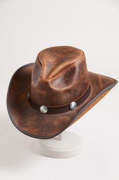 Honor your inner cowboy or cowgirl with the Renegade leather hat. From the handcrafted pinch crown to the 3" vinyl edged shapeable brim, this cowhide leather hat crowns you with good looking western flair. A matching hatband with buffalo conchos adds the perfect finish to a year round hat you can shape to your liking for just the right look, while the adjustable sweatband gives you a custom fit. Rugged Curved Brim Hat For Rodeo, Rugged Leather Hats For Western-themed Events, Vintage Distressed Brown Hat For Rodeo, Leather Hats For Country Events In Distressed Brown, Distressed Brown Leather Hats For Country Events, Vintage Leather Fedora For Rodeo, Leather Distressed Brown Hats For Country Events, Vintage Leather Hat For Western-themed Events, Vintage Brown Fedora For Ranch