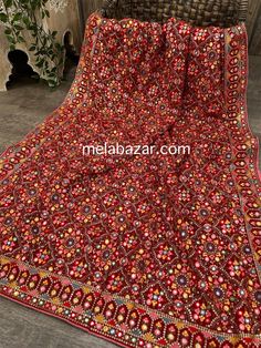 Beautiful georgette dupatta with heavy multicolor embroidery and foil mirror work. Designer Red Mirror Work Dupatta, Traditional Draped Lehenga With Mirror Work In Jamawar, Designer Mirror Work Dupatta For Navratri, Anarkali Jamawar Dupatta With Mirror Work, Anarkali Dupatta With Mirror Work In Jamawar, Bollywood Style Jamawar Dupatta With Mirror Work, Navratri Mirror Work Dupatta, Designer Nida Dupatta With Resham Embroidery, Festival Lehenga With Mirror Work And Nida Material