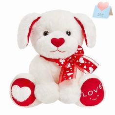 a white teddy bear with a red heart on it's chest