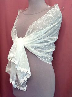 "A chic white wedding cape made of high-quality, slightly elastic fabric. The shrugs shawl is embroidered with silk threads and the hem ends in macramé lace. Bolero, a shawl covering the shoulders of the bride. Scarf measures 58\" x 20\" (150cm x 50cm). Due to the delicate nature of the product, the scarf is a final sale and non-returnable, but if you have any questions, please contact me, I will definitely resolve the issues." Lace Dupatta With Lace Trim, Elegant Embroidered Wedding Shawl, Elegant Lace Dupatta, Elegant Wedding Dupatta With Lace Trim, Elegant Lace Shawl Dupatta, Lace Shawl With Lace Trim For Wedding, Elegant White Crochet Lace Shawl, Elegant White Shawl With Crochet Lace, Elegant Fitted Lace Shawl