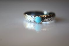 This ring is completely handmade just for you. Those who love turquoise will love this beautiful gemstone. Made with 4mm wide solid sterling silver floral wire, formed into a ring. Added is 1, 4mm serrated bezel cup set with a gorgeous 4mm smooth natural turquoise, the ring is then antiqued and highlighted for depth and to show off this gorgeous floral design. These rings stack up with other slim or skinny rings to add dazzle to your stack! Material Information: Clarity: may have very few Color: Bohemian Turquoise Toe Ring As Gift, Handmade Turquoise Toe Ring As Gift, Handmade Turquoise Toe Ring For Gift, Bohemian Sterling Silver Turquoise Wedding Ring, Artisan Handmade Turquoise Ring For Wedding, Artisan Handmade Turquoise Wedding Ring, Handmade Turquoise Bohemian Promise Ring, Handmade Bohemian Turquoise Promise Ring, Turquoise Toe Ring Jewelry Gift