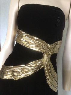 "Vtg 80s A J Bari black and gold Velvet sleeveless Cocktail Dress 8 Preowned. Condition 10/10. No issues to note.  Style A straight form fitting knee length dress,  the bodice is boned for structure and support. Gold lame ribbon swaiths across the bodice give further definition and a unique aspect to this dress. Suitable for any formal, social event, this dress would be a valuable go to in any fashion fashionista wardrobe. Easy to style Fully lined Fastens with a centred rear zip. 7.5\" Front centre kick pleat.  Clipped to the mannequin. Size to fit Australian 10 Go by measurements below garment laid flat Underarm to underarm. 17\". 43cm Waist. 14\". 35.5cm Hips. 18.5\". 47cm Length from underarm. 32\". 81cm Be unique, wear vintage. My photos form an important part of the product descripti Gold Dress Aesthetic, Gold Glitter Dress, Black And Gold Dress, Casino Dress, Gold Chic, Clawdeen Wolf, Gold And Black Dress, Velvet Cocktail Dress, Gold Lame