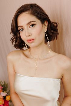 Add a touch of graceful elegance to your bridal look with the Whispering Pearl Drop Earrings! These stunning dangle earrings feature freshwater pearls delicately hanging from a fine gold chain, creating a perfect balance of timeless beauty and modern sophistication. Why do we love them? They’re the perfect blend of chic and classic beauty, making them a must-have for your special day! EARRING FEATURES Material: Brass, Freshwater Pearls Dimensions/Size: 3.2" drop Finish: Polished 14k Gold Plating Classic Beauty, Pearl Drop Earrings, Pearl Drop, Bridal Looks, Gold Plating, Timeless Beauty, Gold Chain, Gold Chains, Freshwater Pearls