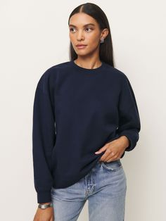 Shop the Emma Classic Crewneck Sweatshirt from Reformation, a relaxed sweatshirt with a crew neckline. Boxy Fit Crew Neck Top With Ribbed Collar, Relaxed Fit Crew Neck Sweats With Ribbed Neckline, Fall Crew Neck Tops With Double-needle Sleeve, Fall Boxy Crew Neck Top, Boxy Fit Crew Neck Top For Fall, Crew Neck Sweatshirt With Ribbed Neckline And Relaxed Fit, Relaxed Fit Crew Sweatshirt With Ribbed Neckline, Relaxed Fit Sweatshirt With Ribbed Neckline, Boxy Crew Neck Sweatshirt For Everyday