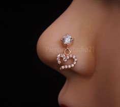 Product Detail : - Material : - 925 Sterling silver, Cubic Zirconia gem stone with Rose Gold Plated,nickle free Plating Color : -  Rose Gold Stone color : - White(as per image) Width : - 6 mm Length : - 11 mm Wire Gauge size : - 22 Gauge / 0.62 mm                                    20 Gauge / 0.80 mm                                   18 Gauge / 1.00 mm                                    16 gauge / 1.2 mm Shipping Detail: Processing Time : - 1-2  Working Day Shipping Time : - 15-20 Working days S Wedding Jewelry With Bling For Valentine's Day, Valentine's Day Wedding Jewelry With Bling, Sparkling Jewelry For Valentine's Day Wedding, Sparkling Jewelry For Wedding On Valentine's Day, Heart-shaped Diamond White Jewelry For Wedding, Nose Stud Indian, Nose Ring Jewelry, Diamond Nose Stud, Face Piercings