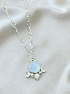 Celestial Silver Gemstone Necklace, Celestial Silver Necklace With Gemstone, Mystical White Moon Necklace, Mystical White Moon-shaped Necklace, Mystical Moon Shaped White Necklace, White Moon Shaped Mystical Necklace, White Moonstone Jewelry With Moon Charm, Bohemian Moonstone Jewelry With Moon Charm, Mystical White Moon Phase Jewelry