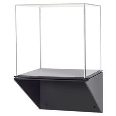 an empty glass display case sitting on top of a black shelf with a white background