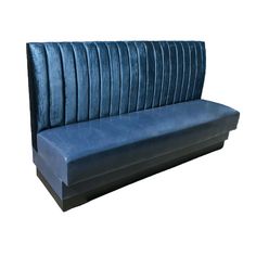 a blue couch with pleated upholstered back and seat cushions on it's sides