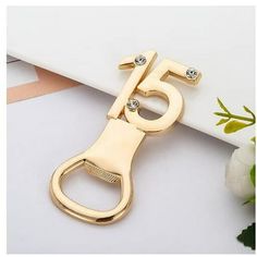 a pair of gold scissors with diamonds on them