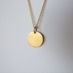 "This minimalistic 14k gold pendant is unisex and a perfect gift for a man. It is made of 14k gold and has an elegant matte finish. The pendant can be ordered by itself or with a chain necklace. You can choose the color of 14k gold of the pendant and the chain necklace will be made of- yellow or white gold. I plate the white gold with rhodium as common in white gold jewelry The diameter of the round pendant is 0.62 inches ( 1.6 cm ).  If you decide to order the pendant with the chain necklace yo Minimalist Round Disc Jewelry With Coin Pendant, Minimalist 14k Gold-filled Medallion Necklace, Minimalist 14k Gold Filled Medallion Necklace, Minimalist Everyday Charm Necklace With Coin Pendant, 14k Gold-filled Yellow Gold Round Disc Necklace, Yellow Gold Charm Necklace With Round Pendant, Everyday Minimalist Charm Necklace With Coin Pendant, Everyday Yellow Gold Circle Charm Necklace, 14k Yellow Gold Circle Necklace