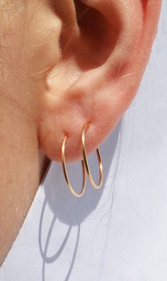 PAIR of 20 gauge tiny hoops for cartilage, helix, nose, or ear piercings 14K YELLOW GOLD FILLED HYPOALLERGENIC & WATERPROOF Wear it in the shower, at work, in the rain, won't tarnish or turn your skin green HANDMADE IN FLORIDA CHOOSE YOUR SIZE Comes in 12 mm 15 mm 20 mm diameters Double Lobe Piercing, Real Gold Hoop Earrings, Double Piercing, Unisex Earrings, Lobe Piercing, Gold Filled Earrings, Gold Hoops, Gold Hoop, In The Rain