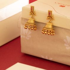 Description: Amp up your accessories style with these antique gold-tone jhumka earrings from Tarinika. These earrings are a fantastic way to elevate any outfit. Style this simple earring with the modern ethnic outfit. Details & Specifications: Materials used: Brass Alloy with Antique platingWeight – Earring-19 gmLength – Earring-4.5 cmMake it customWant to make it a custom earring? Sure! Reach out to us at support@tarinika.com and we’ll be happy to make possible modifications at no extra cost. F Luxury Gold Jhumkas, Luxury Designer Jhumkas For Diwali, Cheap Gold Chandbalis For Wedding, Gold Earring Ideas, Wedding Jhumkas Bridal Jewelry, Bohemian Cheap Jhumkas For Diwali, Luxury Temple Jewelry Jhumkas, Luxury 22k Gold Ceremonial Earrings, Luxury Traditional Jhumkas