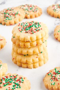 several cookies with sprinkles are arranged on a table