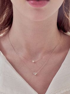 Editor's NoteENGBROX's adorable jewelry can be a stylish point for various casual stylings. - Small and lovely layered necklace- Small sized pearl and heart pendants- Good to give an accent on any outfits- Daily point itemMeasurements (in.)- Size: 14.17 in. / 15.75 in.- Pearl: 0.16 in. / 0.24 in. Composition & Care- Silver925 + Artificial Pearl- Be careful for allergic- Avoid direct moisture and heat- They can be damaged by exceed force- Keep in a sealed zipper bag*Due to the Everyday Pearl Charm Necklace For Mother's Day, Pearl Charm Necklaces For Layering, Everyday Heart Shaped Necklace With Pearl Charm, Elegant Necklaces With Heart Beads, Elegant Everyday Necklaces With Heart Beads, Elegant Heart Beads Necklace, Elegant Necklace With Heart Beads, Elegant Heart Shaped Necklace For Layering, Delicate Heart Necklace With Pearl Charm