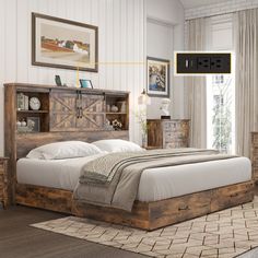 a bed room with a neatly made bed and dressers