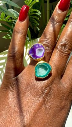 Bring a piece of nature's magic into your wardrobe with this striking purple and green geode ring! The natural crystal formations within each stone sparkle with an organic elegance, making it a truly one-of-a-kind accessory. The band is designed for comfort, ensuring you can wear it all day without losing any of its charm. Whether you are dressed up or casual, this ring adds a pop of colorful shimmer to your style. Size 8.5-9.5 Green Geode, Purple Geode, Geode Ring, Crystal Formations, Purple And Green, Crystal Rings, Ring Ring, Bracelet Gift, Natural Crystals