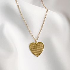 Gold-filled reversible heart pendant strung on dainty 14k gold-filled chain. Sweet alone, even better layered. Length: 18” delicate 14k gold-filled chain Pendant: 1” Handmade Lobster clasp Includes 100% organic cotton jewelry pouch Pairs perfectly with our Soulmate Toggle Bracelet This item is made to order and shipped with love from our studio located in West Chester, PA. *Click here to learn more about gold filled jewelry 14k Gold-filled Heart Necklace With Heart Charm, Everyday 14k Yellow Gold Filled Heart Necklace, 14k Gold Filled Necklaces For Everyday Valentine's Day, Everyday 14k Gold Filled Necklaces For Valentine's Day, Everyday Gold Charm Necklaces With Heart Beads, 14k Gold Filled Necklaces For Valentine's Day, Everyday Gold Heart Beads Necklace, Everyday Gold Heart Necklace With Heart Beads, Dainty Heart Chain Necklace For Mother's Day