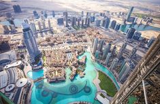 an aerial view of the city and its surrounding water features in this photo taken from above