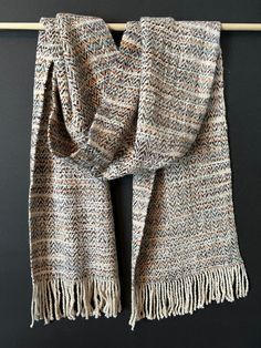 "Handwoven rayon chenille and silk neck scarf, in a herringbone pattern The color is a creamy natural, with variegated rayon chenille in copper, steel blue, brown, gray, and natural. The scarf measures 13\" wide x 63\" long, plus 3\" of fringe on each end.  Hand wash in cold water with ivory liquid or dry clean. Handwoven at Newark IL" Silk Neck Scarf, Neck Scarf, Herringbone Pattern, Neck Scarves, Steel Blue, Silk Scarf, Blue Brown, Herringbone, Scarf Wrap